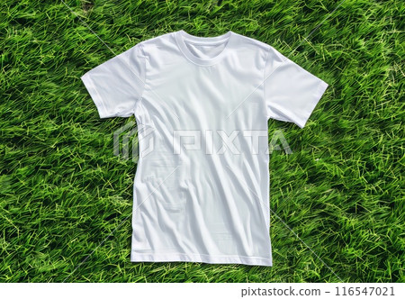 White t-shirt on green park texture. Cotton tshirt in nature grass lawn background. Mockup blank fashion meadow design. Empty mock up cloth collection. Casual blank shirt textile 116547021