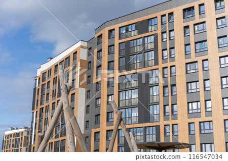 Modern brown building facade with shiny mirror windows Modern brown building facade with shiny mirror windows 116547034