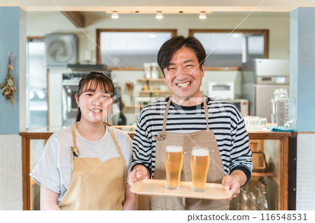 Izakaya, restaurant, cafe staff with a glass of draft beer 116548531
