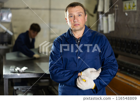 Adult man posing in metallurgical workshop 116548809