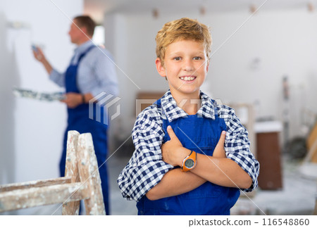 Preteen boy posing on indoor construction site 116548860