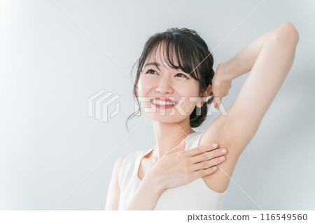 Smiling Asian woman with depilation and deodorant image 116549560