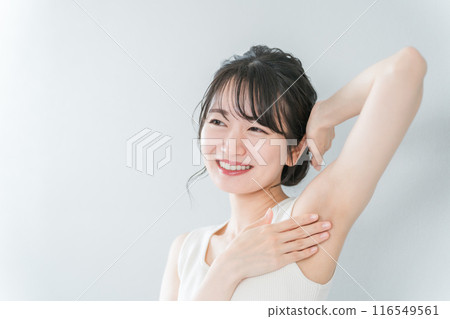 Smiling Asian woman with depilation and deodorant image Smiling Asian woman with depilation and deodorant image 116549561