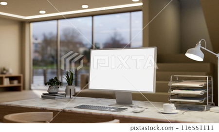 A computer with a white-screen mockup on a marble table in a modern, luxurious living room. 116551111