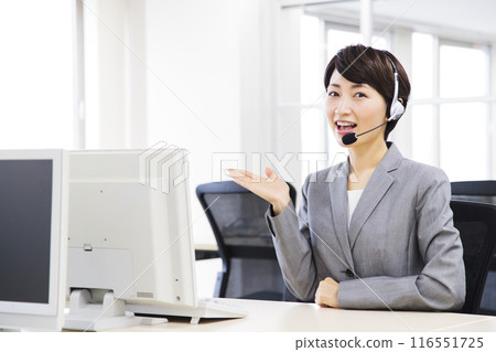 Middle-aged woman working in a call center Middle-aged woman working in a call center 116551725