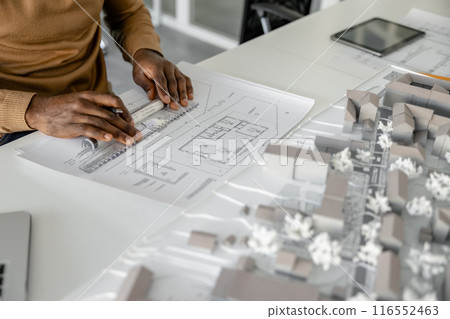 Skillful man architect using technology in his workplace Skillful man architect using technology in his workplace 116552463