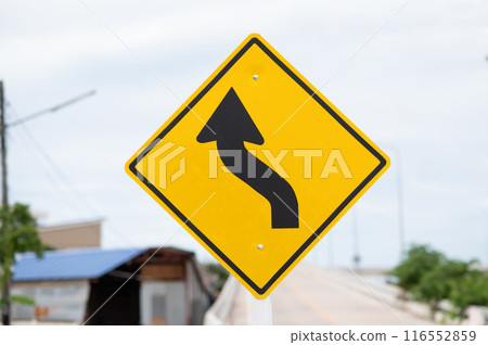 Selective focus of Left curve warning sign. Selective focus of Left curve warning sign. 116552859