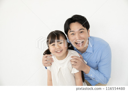Father and daughter smiling at the camera Father and daughter smiling at the camera 116554480