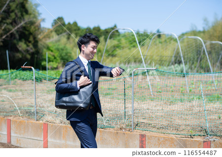 Farm and business person Farm and business person 116554487