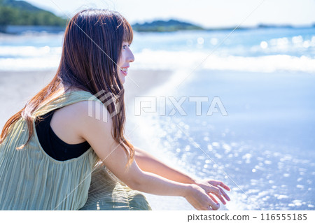 Young woman refreshing in the sea Young woman refreshing in the sea 116555185
