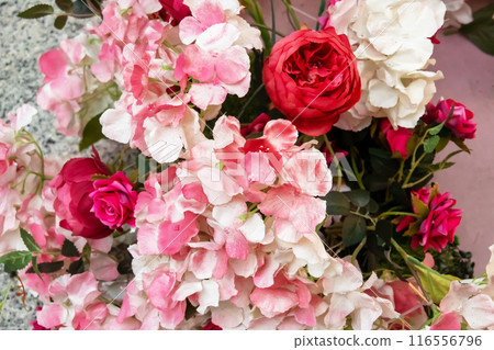 Artificial Pink Flowers in Basket close up 116556796