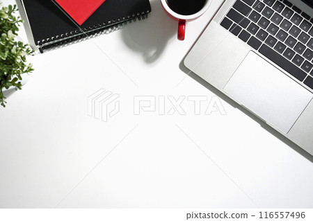 White office desk with a cup of coffee, laptop and notebook. Top view with copy space White office desk with a cup of coffee, laptop and notebook. Top view with copy space 116557496