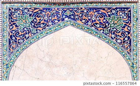 Detail of traditional persian mosaic wall with geometrical and floral ornament, Iran. Horizontal background with ceramic tile frame. Mock up template. Copy space for text Detail of traditional persian mosaic wall with geometrical and floral ornament, Iran. Horizontal background with ceramic tile frame. Mock up template. Copy space for text 116557864