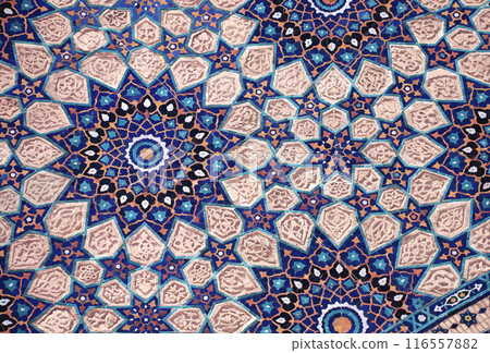 Vertical or horizontal background with detail of ancient mosaic walls with floral and geometric ornaments. Traditional iranian tile decorations Vertical or horizontal background with detail of ancient mosaic walls with floral and geometric ornaments. Traditional iranian tile decorations 116557882