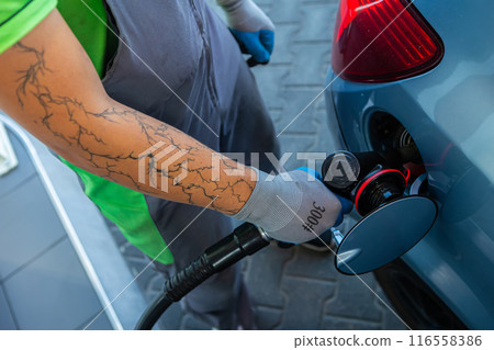 Hand Man Refill and filling Oil Gas Fuel at station. Gun petrol in the tank to fill. Hand Man Refill and filling Oil Gas Fuel at station. Gun petrol in the tank to fill. 116558386