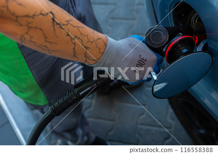 Hand Man Refill and filling Oil Gas Fuel at station. Gun petrol in the tank to fill. 116558388
