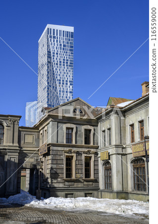 21st-century skyscraper and scenery of 19th-century Moscow buildings. The inscription on the sign 21st-century skyscraper and scenery of 19th-century Moscow buildings. The inscription on the sign 116559000
