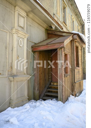 Decorations of building in Moscow, 19 century Russia with wooden door and windows, at a film studio Decorations of building in Moscow, 19 century Russia with wooden door and windows, at a film studio 116559079