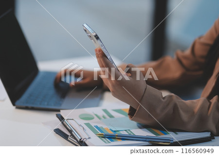 Hand woman work using smartphone with white background for advertising, smartphone screen blank mockup, clipping path. Hand woman work using smartphone with white background for advertising, smartphone screen blank mockup, clipping path. 116560949