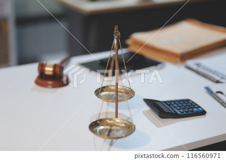 Judge gavel with Justice lawyers having team meeting at law firm background. Concepts of Law and Legal services. 116560971