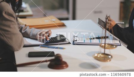 Consultation and conference of lawyers and professional businessman working and discussion having at law firm in office. Concepts of law, Judge gavel with scales of justice. 116560978