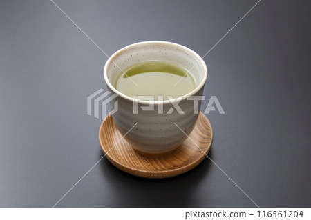 Green tea on a black background 116561204