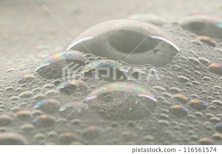 Many bubbles foam from soap bath shampoo shower gel on surface. Fluffy bath foam or beer bubble froth on surface wave curve texture form bubble 116561574