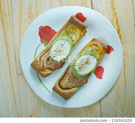 Pastry tart bacon cheese and zucchini Pastry tart bacon cheese and zucchini 116561829