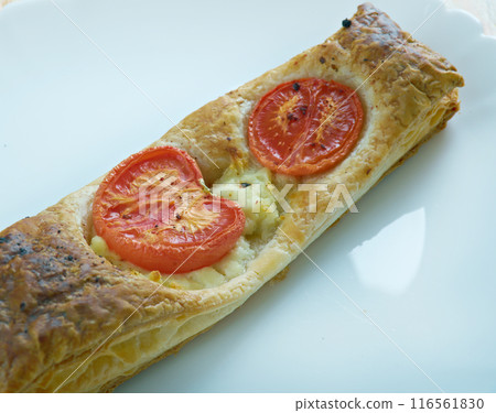 Pastry tart with cheese and tomatoes Pastry tart with cheese and tomatoes 116561830