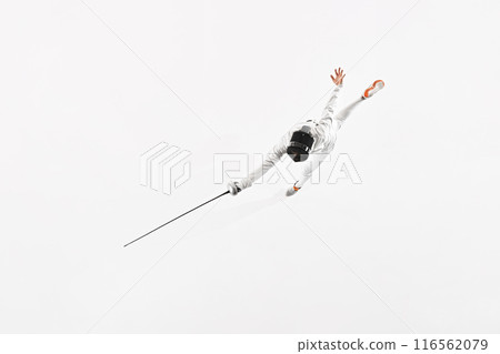 Aerial view of fencer in white uniform and mask from above, mid-leap with their rapier extended forward against white studio background. 116562079