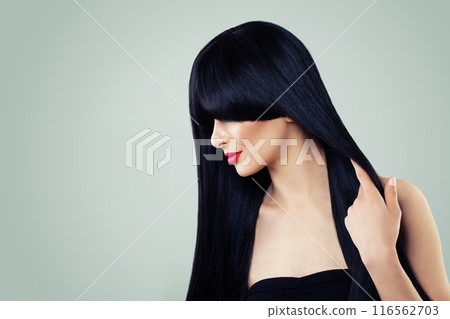 Pretty young model woman with long healthy dark straight smooth hair Pretty young model woman with long healthy dark straight smooth hair 116562703