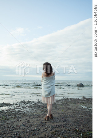Lonely healthy brunette woman with long hairstyle and fresh skin walking outdoors 116564568