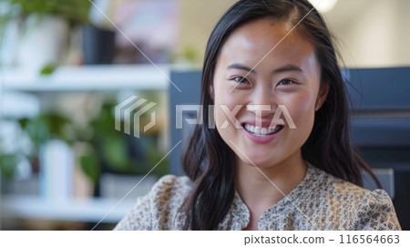 Portrait of a Smiling Young East Asian Woman in a Modern Office Setting, Natural Lighting, Professional Atmosphere 116564663