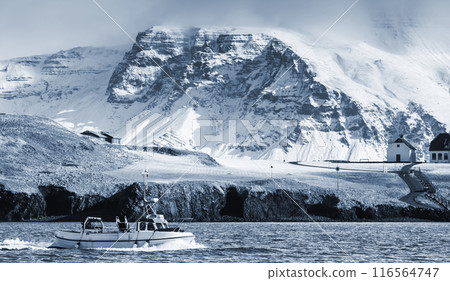White fishing boat sails the bay of Reykjavik on a sunny day, Iceland White fishing boat sails the bay of Reykjavik on a sunny day, Iceland 116564747