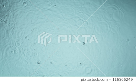 Freeze motion of splashing water drops on on light blue background Freeze motion of splashing water drops on on light blue background 116566249