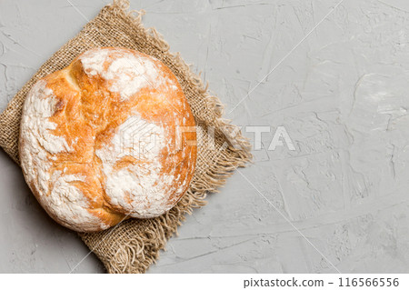Fresh homemade crisp round bread on napkin, top view. Healthy unleavened bread. French bread. Top view Bakery products Fresh homemade crisp round bread on napkin, top view. Healthy unleavened bread. French bread. Top view Bakery products 116566556
