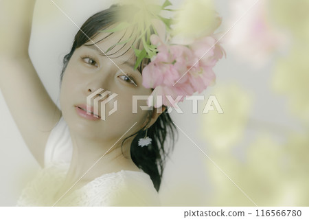 Portrait of a young woman with flowers Portrait of a young woman with flowers 116566780