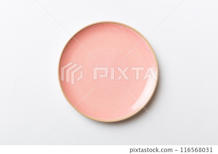 Top view of isolated of colored background empty round pink plate for food. Empty dish with space for your design Top view of isolated of colored background empty round pink plate for food. Empty dish with space for your design 116568031