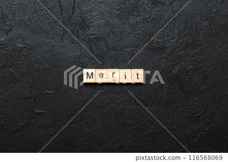 merit word written on wood block. merit text on table, concept 116568069