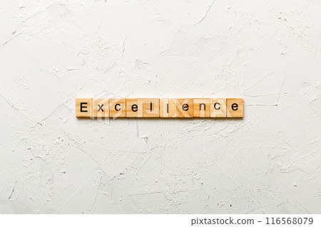 Excellence word written on wood block. Excellence text on cement table for your desing, concept 116568079