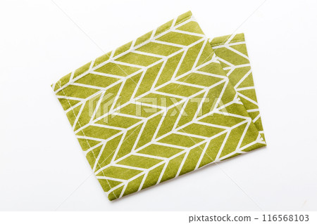 top view with green kitchen napkin isolated on table background. Folded cloth for mockup with copy space, Flat lay. Minimal style top view with green kitchen napkin isolated on table background. Folded cloth for mockup with copy space, Flat lay. Minimal style 116568103