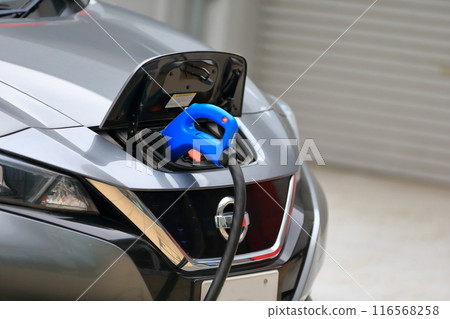 Image of electric car being charged Image of electric car being charged 116568258