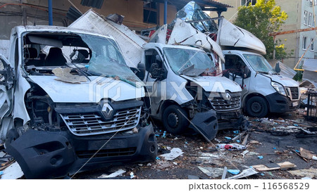 Broken and burned cars after a missile attack on a Ukrainian city. 116568529