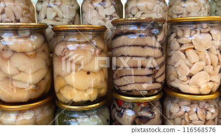 Canned mushrooms in jars. Panorama. Canned mushrooms in jars. Panorama. 116568576