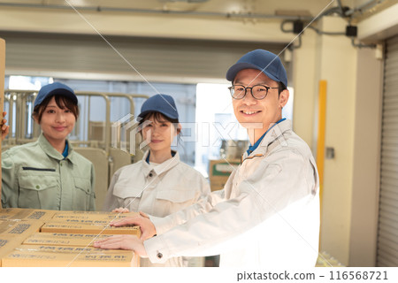 Three men and women working in a warehouse Three men and women working in a warehouse 116568721