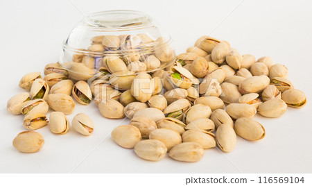 Roasted pistachios on white background 116569104