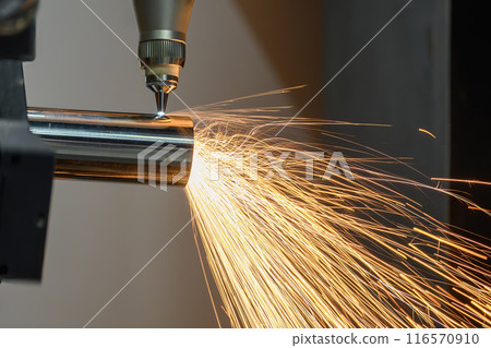 Close up scene the fiber laser cutting machine cut the stainless steel tube and sparkling light. Close up scene the fiber laser cutting machine cut the stainless steel tube and sparkling light. 116570910