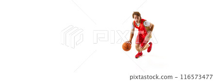 Banner. Young man, basketball athlete training dribbling technique against white studio background with negative space to insert text. 116573477