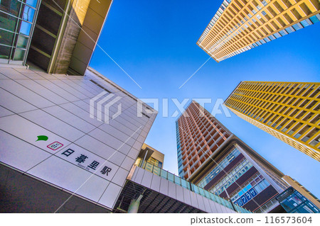 Tokyo cityscape in July. View of Nippori Station and the tower apartment complex in front of the station (5th) Tokyo cityscape in July. View of Nippori Station and the tower apartment complex in front of the station (5th) 116573604