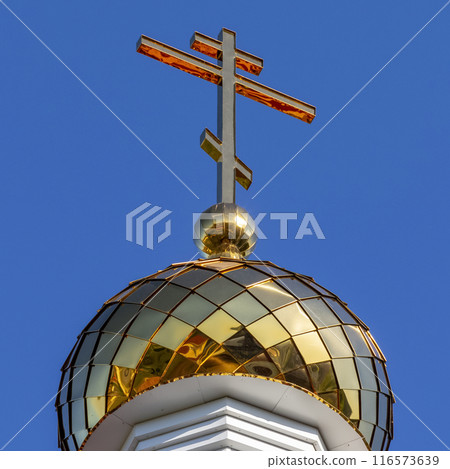Golden cross on the temple 116573639